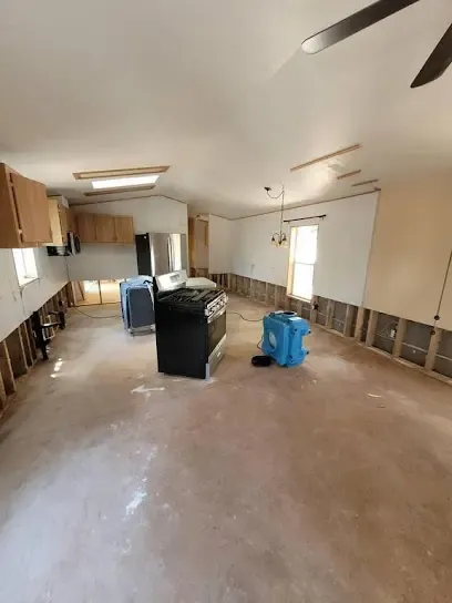 Drying equipment set in a room with the baseboards removed